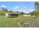 A spacious backyard featuring a screened lanai, perfect for outdoor living and entertaining at 136 Triplet Lake Dr, Casselberry, FL 32707
