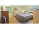 Comfortable bedroom featuring a soft rug, bright windows, and green paint at 136 Triplet Lake Dr, Casselberry, FL 32707