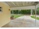 A home exterior featuring a covered carport area with a front yard view at 136 Triplet Lake Dr, Casselberry, FL 32707