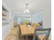 The dining area showcases a wooden table, a built-in shelf and an open layout to the living spaces at 136 Triplet Lake Dr, Casselberry, FL 32707