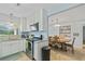 Well-lit kitchen with stainless steel appliances, granite countertops, and an open view to the dining area at 136 Triplet Lake Dr, Casselberry, FL 32707