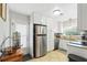 The kitchen features white cabinetry, granite countertops, and stainless steel appliances for a modern appeal at 136 Triplet Lake Dr, Casselberry, FL 32707