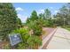 The entrance to Lake Concord Park with manicured landscaping at 136 Triplet Lake Dr, Casselberry, FL 32707