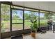 A serene screen patio view of the expansive backyard, featuring well-maintained landscaping at 136 Triplet Lake Dr, Casselberry, FL 32707