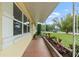 Inviting porch with tile flooring, potted plants, and plenty of light at 136 Triplet Lake Dr, Casselberry, FL 32707