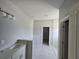 Bathroom with shower and modern vanity with bright lighting at 141 W G H Washington St, Apopka, FL 32703
