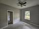 Bedroom with a ceiling fan and window view at 141 W G H Washington St, Apopka, FL 32703