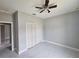 New bedroom shows walk-in closet and ceiling fan, all ready for finishing and move in at 141 W G H Washington St, Apopka, FL 32703
