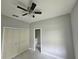Bedroom featuring a ceiling fan, closet, and neutral paint at 141 W G H Washington St, Apopka, FL 32703