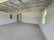 Spacious garage with brick walls and windows at 141 W G H Washington St, Apopka, FL 32703