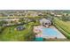 Overhead view of the community pool, playground, and well-maintained landscaping at 1467 Selbydon Way, Winter Garden, FL 34787