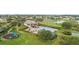 Aerial view featuring a community pool, playground, and lush green spaces at 1467 Selbydon Way, Winter Garden, FL 34787