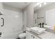 Updated bathroom with a bathtub, shower, and a white vessel sink with black fixtures at 1467 Selbydon Way, Winter Garden, FL 34787