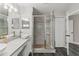 Bright bathroom boasting a double sink vanity and enclosed glass shower at 1467 Selbydon Way, Winter Garden, FL 34787