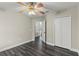 Bedroom features wood floors, view of hall, and a double door closet for storage at 1467 Selbydon Way, Winter Garden, FL 34787