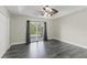 Spacious bedroom featuring a fan, a closet, and a sliding door with views of the outdoor foliage at 1467 Selbydon Way, Winter Garden, FL 34787