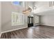 Inviting foyer with sleek wood floors, staircase, and modern lighting fixtures, creating a grand entrance at 1467 Selbydon Way, Winter Garden, FL 34787