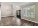 Inviting foyer with sleek wood floors, staircase, and modern lighting fixtures, creating a grand entrance at 1467 Selbydon Way, Winter Garden, FL 34787