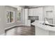 Well-lit kitchen with a wine cooler and a window offering views of an outdoor grill at 1467 Selbydon Way, Winter Garden, FL 34787