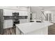 Beautiful kitchen with stainless steel appliances, quartz countertops, and an island with a sink at 1467 Selbydon Way, Winter Garden, FL 34787