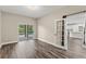 Bright living room with access to the pool and an open doorway to the kitchen area at 1467 Selbydon Way, Winter Garden, FL 34787