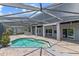 Enclosed pool with brick pavers, outdoor kitchen, and a covered patio at 1467 Selbydon Way, Winter Garden, FL 34787