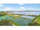 Recreational area with basketball, tennis, volleyball, and ice rink, set against a scenic lake backdrop at 1467 Selbydon Way, Winter Garden, FL 34787