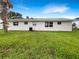 Well-maintained backyard with a lush green lawn and privacy at 1623 Crestlawn Ave, Orlando, FL 32811