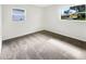 Bedroom featuring neutral paint, carpet, and lots of natural light at 1623 Crestlawn Ave, Orlando, FL 32811