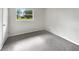 Clean and bright bedroom featuring neutral paint and new carpet at 1623 Crestlawn Ave, Orlando, FL 32811