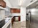 Eat-in kitchen features stainless steel appliances, granite countertops, and ample cabinet space at 1623 Crestlawn Ave, Orlando, FL 32811