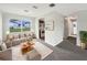 Comfortable living room with plush carpet, modern furniture, and bright natural light at 1623 Crestlawn Ave, Orlando, FL 32811