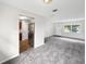 View of open living space, featuring fresh paint and new carpeting at 1623 Crestlawn Ave, Orlando, FL 32811