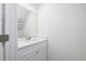 Bathroom vanity featuring a bright mirror, white cabinets, and neutral countertops at 164 14Th Ave, Longwood, FL 32750
