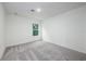 Bright bedroom with a window, soft carpet, and ample space for furniture, creating a serene and inviting atmosphere at 164 14Th Ave, Longwood, FL 32750
