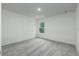 A bright bedroom featuring gray carpet, white walls, and a window providing natural light at 164 14Th Ave, Longwood, FL 32750