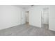 A bright bedroom featuring gray carpet, white walls, with a closet and doorway at 164 14Th Ave, Longwood, FL 32750