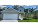 Charming two-story home featuring a well-maintained lawn and attached two-car garage at 164 14Th Ave, Longwood, FL 32750