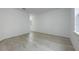 Bright hallway with wood-look floors and a window that leads to additional rooms and closet space at 164 14Th Ave, Longwood, FL 32750