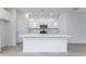 Bright and airy kitchen featuring white cabinets, stainless appliances, and quartz countertops at 164 14Th Ave, Longwood, FL 32750