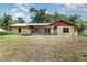 View of the home's back yard and enclosed patio area at 175 Cliff St, Deland, FL 32720