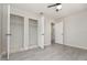 An empty bedroom shows open closet and doorway into an attached area in neutral tones at 175 Cliff St, Deland, FL 32720