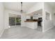 Dining area with sliding doors to the outside screened porch, open to the kitchen and living room at 175 Cliff St, Deland, FL 32720