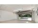 Empty garage shows an open automatic door and access to a backyard parking area at 175 Cliff St, Deland, FL 32720
