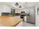 Bright kitchen featuring stainless steel appliances, white cabinets, and stylish backsplash at 175 Cliff St, Deland, FL 32720