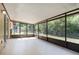 Large screened-in porch offers view of the fenced in backyard and lots of space at 175 Cliff St, Deland, FL 32720