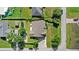Aerial view of property showcasing landscaping, driveway, and neighborhood at 1880 Lorraine Way, St Cloud, FL 34769