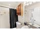 Full bathroom featuring a shower with a black shower curtain, vanity, and tile flooring at 1880 Lorraine Way, St Cloud, FL 34769