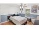 Comfortable bedroom featuring a ceiling fan, neutral color scheme, and natural light from the window at 1880 Lorraine Way, St Cloud, FL 34769