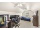 Spacious bedroom with vaulted ceilings and a large window, perfect for relaxation and study at 1880 Lorraine Way, St Cloud, FL 34769
